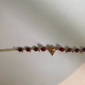 Vintage bracelet with heart charm and brown flower shaped beads